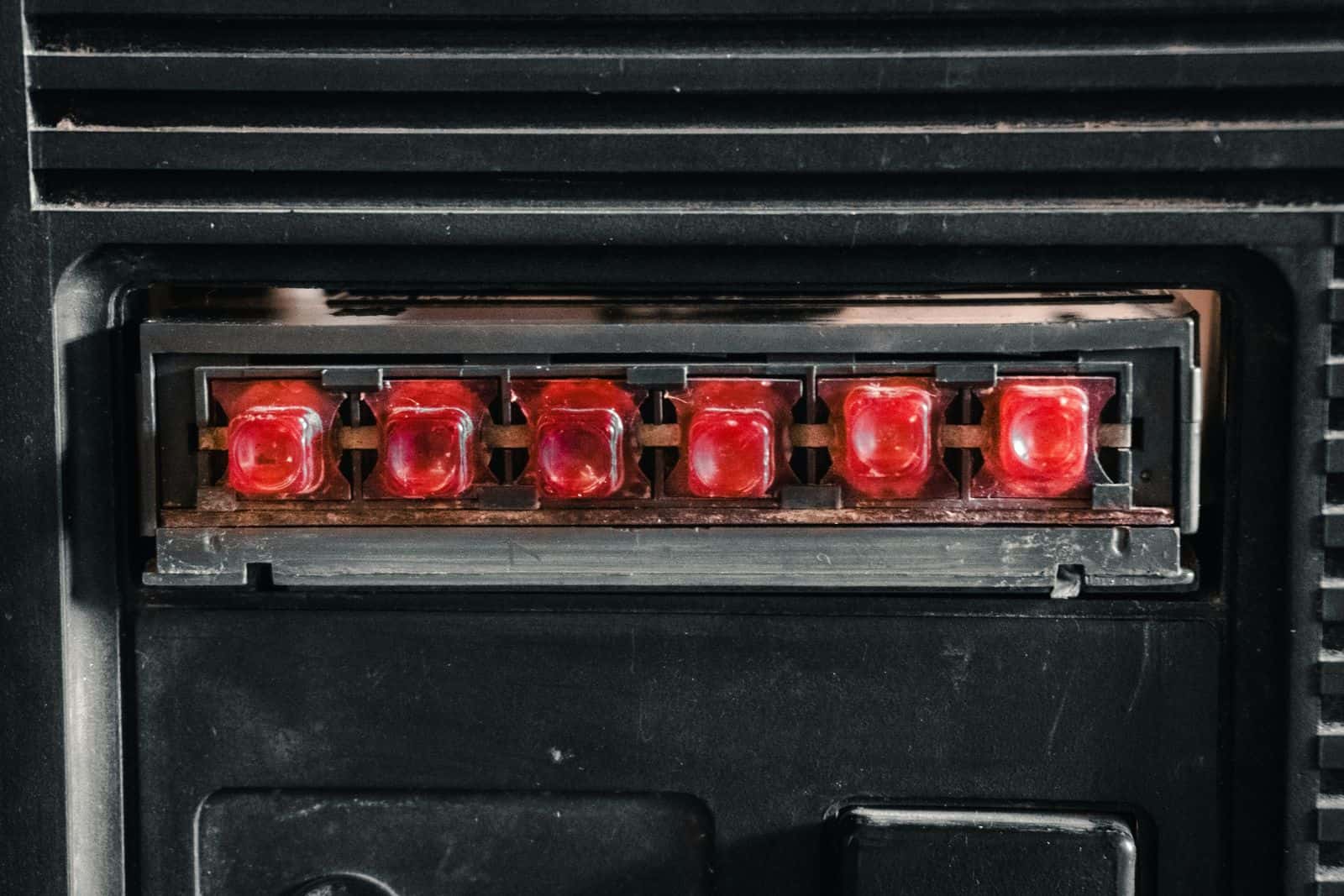 Red indicator lights lit on a control panel